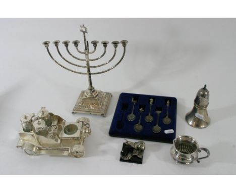A small group of silver plated items comprising a novelty condiment set in the form of an open top car,an unusual set of five