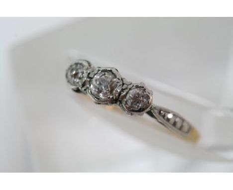 An 18ct gold and platinum 3 stone diamond ring