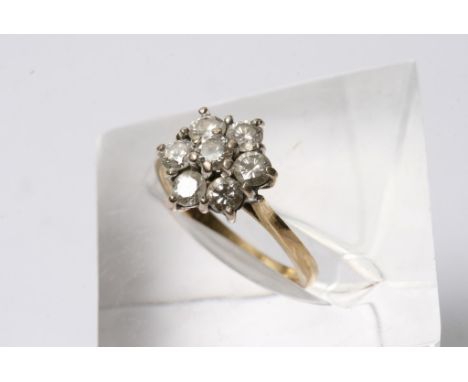 An 18ct gold and diamond cluster ring, slightly under one carat