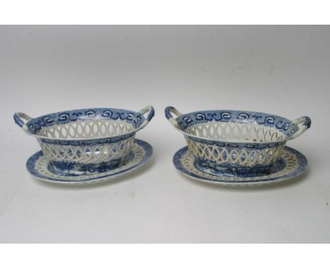 A pair of quality early 19th century blue and white ceramic baskets decorated in the oriental style, with pieced lattice work