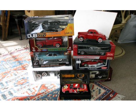 A collection of 9 boxed 1/18th scale model vehicles including dub city, Kyosho etc 