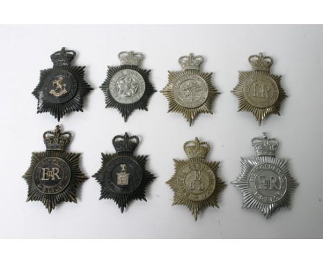 Eight post 1953 police helmet plates comprising Newport, Ipswich, Lancashire, Kent, Metropolitan, Bristol and Somerset and Ba