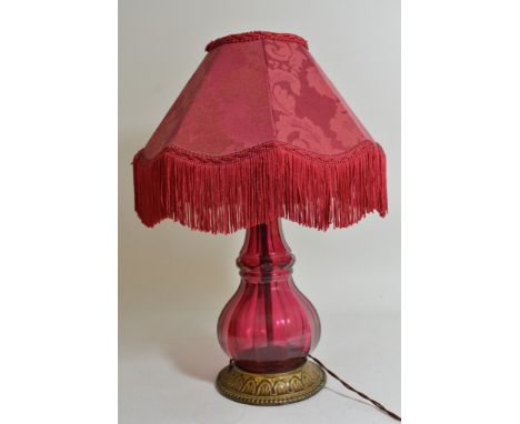A Victorian style Bohemian glass side lamp with gilt metal base