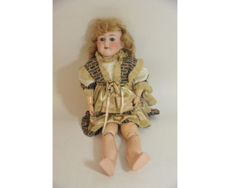 A German bisque headed doll by Max Handwerck having closing eyes and open mouth