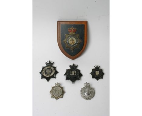 Six post 1953 police helmet plates comprising British Transport, Devon, Bedfordshire and two West Suffolk and Middlesbrough m