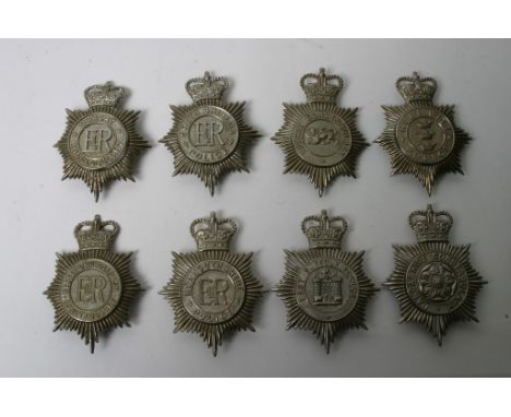 Eight post 1953 police helmet plates comprising Hull City, Bedfordshire, Monmouthshire, Lancashire, Surrey, South Sheilds, Do