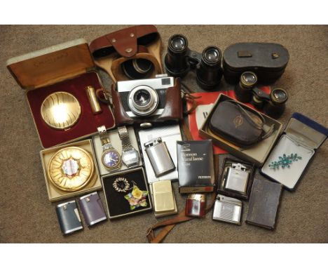 A bag containing a  Werra camera, two small pairs of binoculars, lighters and compacts