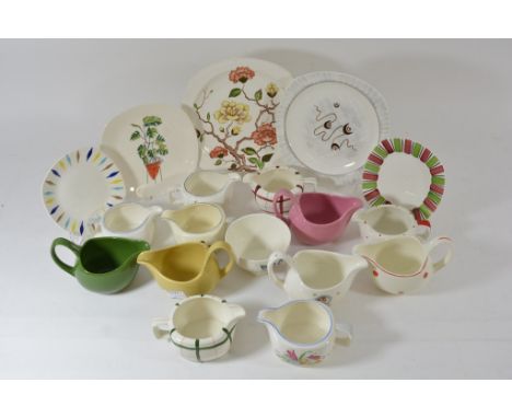 A collection of Midwinter jugs and plates, various patterns.