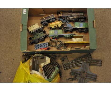 A Hornby electric three rail train set comprising engine, tender, wagons and station platforms with track
