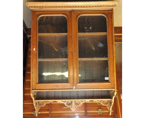 An Edwardian hanging display cabinet, with a pair of glazed doors and an open shelf section