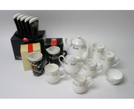 A Harrod's white china tea service with giltwork decoration together with three boxed Guinness advertising items.
