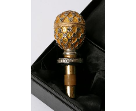 A retrospective metal and yellow egg shaped walking stick handle Stamped Faberge 