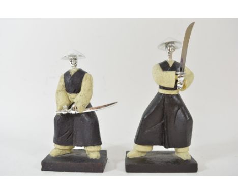 A pair of composition figures in the form of Japanese swordsman