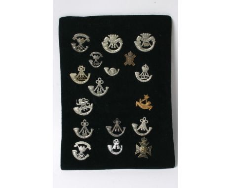A collection of seventeen various light infantry badges some of which are retrospective copies
