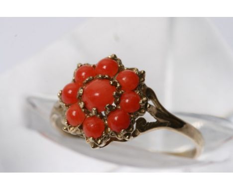 A 9ct gold ring set with coral