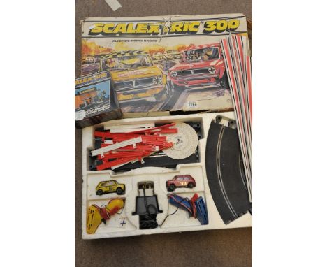 A Scalextric 300 set and boxed pit stop (playworn) (2)