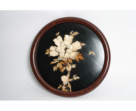 A similar round Japanese plaque with raised decoration of flowers and foliage - 42 cms