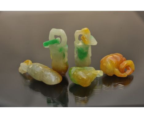 A collection of five multi colour jade good luck charms 