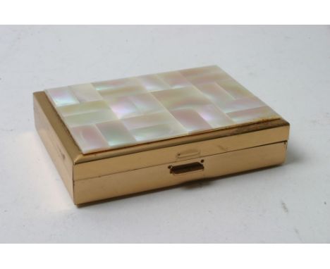 A Swiss made musical compact with mother of pearl lid