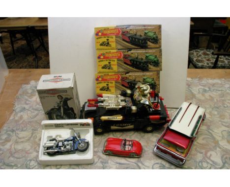 A box containing a collection of model vehicles including a Polistil Harley Davidson motorbike, three American "roundhouse" A