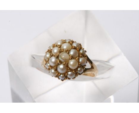 A 9ct gold ring set with seed pearl