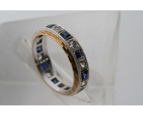 An 18ct gold, blue and white sapphire ring