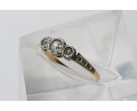 An 18ct gold and platinum ring inset with 3 CZs