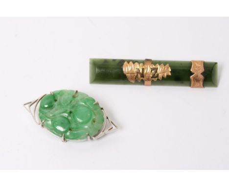  A 9ct white gold mounted jade brooch and one other gold mounted brooch (2)