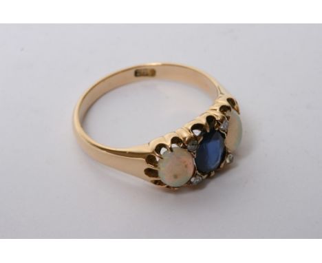 An 18ct gold ring set with large sapphire and two opals with four small diamonds. 