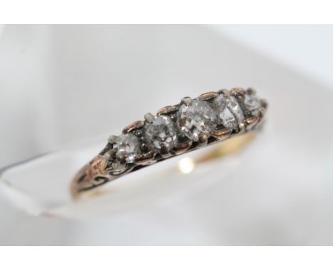 An unmarked ring set with diamonds.