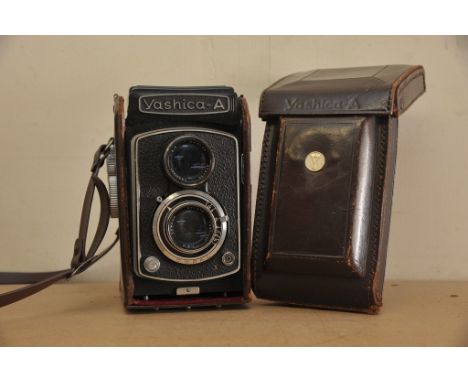 A Yashica camera in a leather case