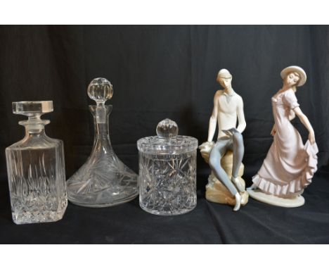 Two cut glass decanters and a biscuit barrel plus Lladro and Nao figures