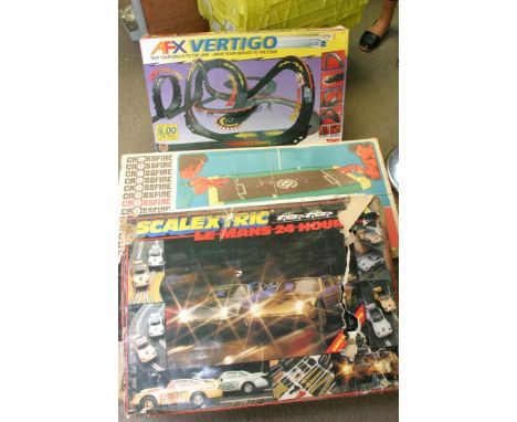 A boxed Tomy Vertigo Racing set, a boxed Scalextric Lemans set and a boxed crossfire set 
