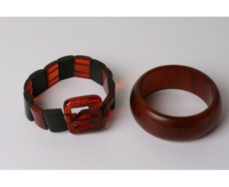 An early plastic bracelet formed as a belt and a bangle, both possibly Bakelite