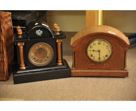 A metal mantel clock and an oak case clock