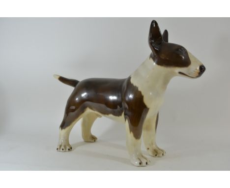 A large ceramic model of a Staffordshire bull terrier
