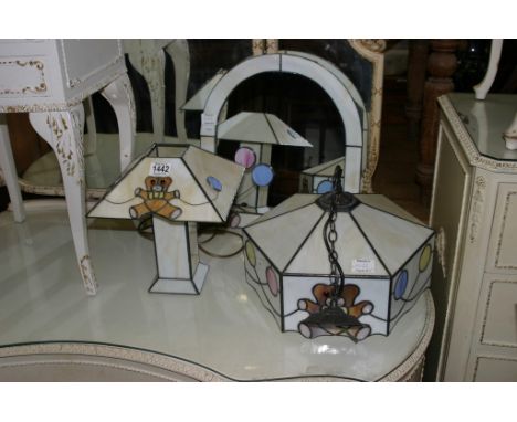 Three Tiffany style children's bedroom items comprising mirror, ceiling light and table lamp.