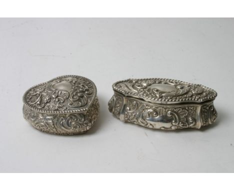 Two silver repousse decorated trinket boxes, one heart shaped, both bearing Chester hallmarks