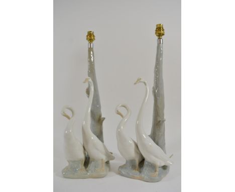 A large pair of boxed Nao porcelain lamp bases in the form of geese.