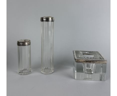 A SILVER MOUNTED CANDLEHOLDER ALONG WITH TWO VANITY JARS
