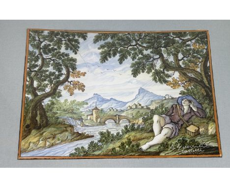 A MAJOLICA CASTELLI TILE DEPICTING A SLEEPING YOUTH, SIGNED A. GUERNIERI40cm x 30cmTwo repairs.Framed and glazed 62cm x 52cm