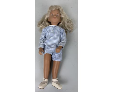 A VINTAGE SASHA BLONDE GINGHAM DOLL40cmsTogether with original roundel wrist Sasha logo tag and marketing booklet for Sasha d