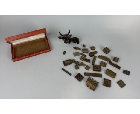 A COLLECTION OF AFRICAN BRONZE ASHANTI (IVORY COAST) GOLD WEIGHTSHoused in a vintage Omega Seasmaster box.