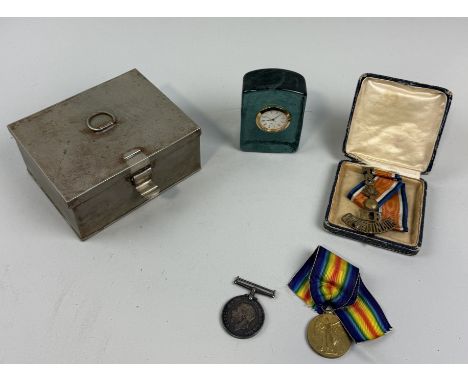 A SILVER PLATED BOX WITH THREE WAR MEDALS AND A GLASS MANTLE CLOCK 