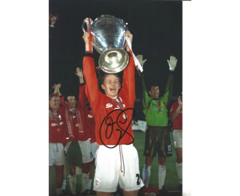 Ole Gunnar Solskjær 12x8 signed colour photo pictured lifting the Champions League Trophy during his playing days with Manche