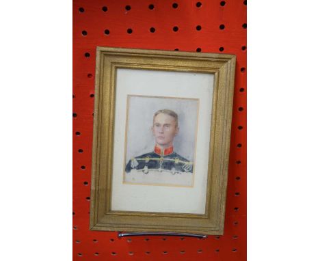 Framed pair of watercolour portrait miniatures depicting a gentleman in uniform and a lady, each approx 7.5 x 6cm