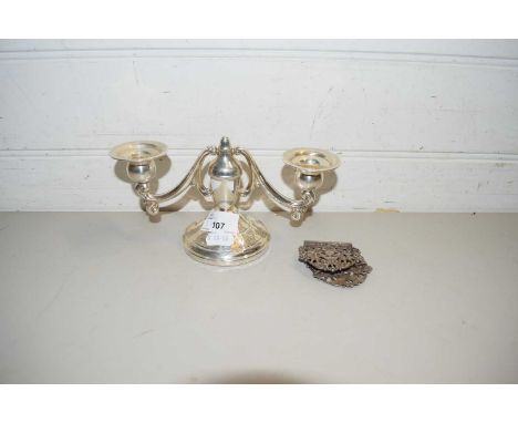 SMALL STERLING SILVER TWO-LIGHT CANDELABRA, PROBABLY AMERICAN, SET ON A LOADED BASE, TOGETHER WITH A PAIR OF WHITE METAL BUCK