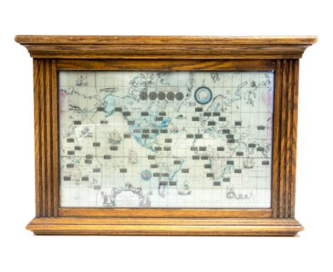 An oak cased world clock by Howard Miller Clock Co, Michigan USA 