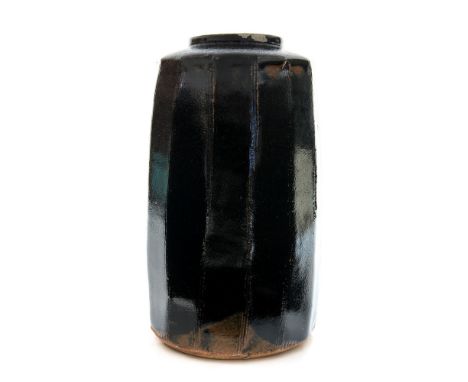 Kenneth Quick for Leach Pottery, a St Ives studio pottery vase, faceted cylindrical form, tenmoku glaze, impressed seal marks