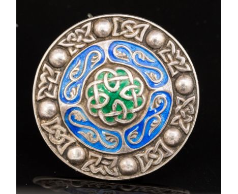 After Alexander Ritchie, an Iona, Celtic design silver and enamelled target brooch, blue and green enamel, A H Darby and Sons